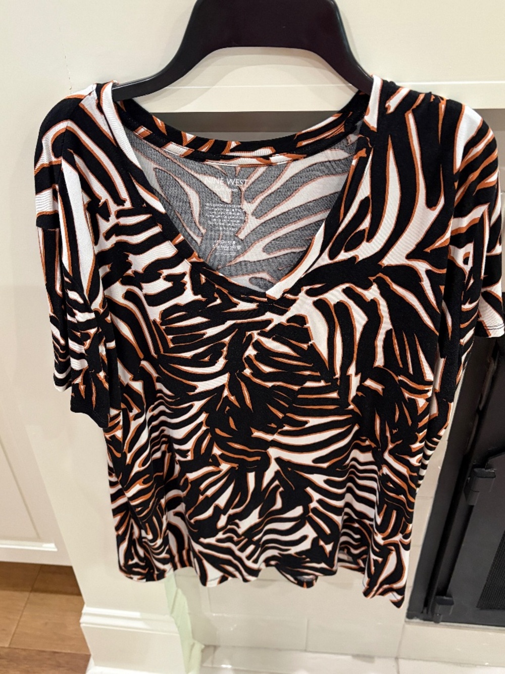 None West brown and black patterned v-neck top size large
